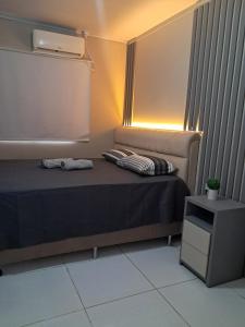 Ένα ή περισσότερα κρεβάτια σε δωμάτιο στο Casa temporada aconchegante 10 pessoas Navegantes SC