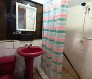 a bathroom with a red sink and a shower at Sumaq Tika in Cusco +9 photos