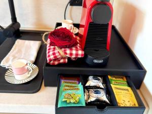 a black box with a toaster and cups and tea at Dog-friendly holiday apartment in Bregenzerwald in Sibratsgfäll