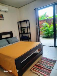 Ένα ή περισσότερα κρεβάτια σε δωμάτιο στο Moon Home Sand #2