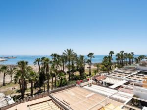 a view of the beach from the roof of a building at Seaside Escape in Benalmádena in Benalmadena Costa