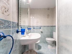 a bathroom with a sink and a toilet at Seaside Escape in Benalmádena in Benalmadena Costa +13 photos