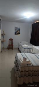 Ένα ή περισσότερα κρεβάτια σε δωμάτιο στο Hostal Vilchez