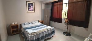 Ένα ή περισσότερα κρεβάτια σε δωμάτιο στο Hostal Vilchez