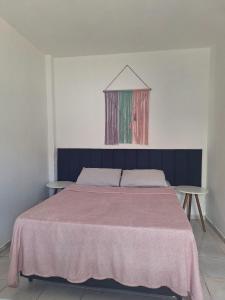 Postel nebo postele na pokoji v ubytování 3 Kitnets