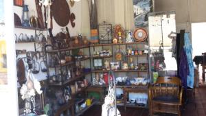 a room filled with shelves filled with lots of items at Posada Guasu in Samaipata