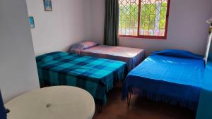 En eller flere senge i et værelse på La Cabaña