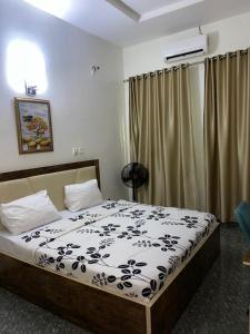 Postel nebo postele na pokoji v ubytování Goldeekion