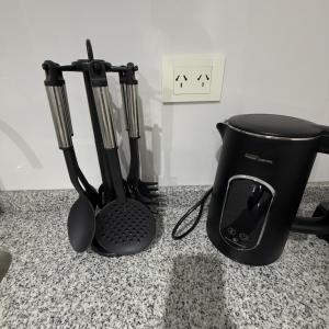 a black blender sitting on top of a counter at Espacio Uno B in Belén de Escobar