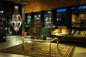 a living room with a couch and a coffee table at Hotel V Fizeaustraat in Amsterdam