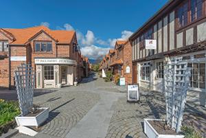 an empty street in an old brick building at Monaco Shores Apartment in Nelson