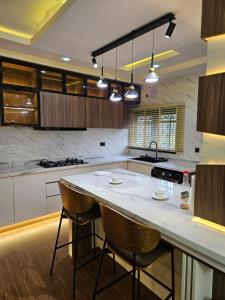 Η κουζίνα ή μικρή κουζίνα στο TTA Apartments