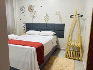 a bedroom with a bed and a ladder in it at Le Chardon Residence in Ananindeua