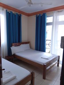 Postel nebo postele na pokoji v ubytování Mtwapa Luxurious with Pool 102