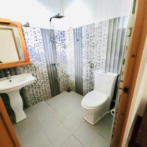 a bathroom with a toilet and a sink at The Ceylan Crest ELLA in Ella