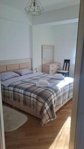 Ένα ή περισσότερα κρεβάτια σε δωμάτιο στο Sanmarko