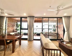 a living room with a table and a couch at Wins Residences Hanoi in Hanoi +90 photos