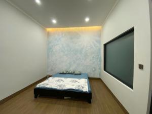 Postel nebo postele na pokoji v ubytování Home Nam Phương -Bảo Lộc