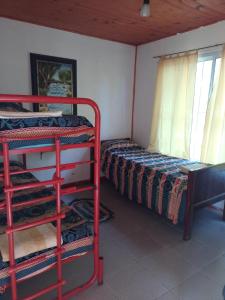 Postel nebo postele na pokoji v ubytování Cabañas Tía Moca