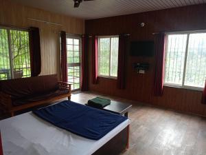 Ένα ή περισσότερα κρεβάτια σε δωμάτιο στο Bima Farm