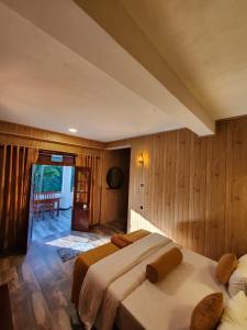 Postel nebo postele na pokoji v ubytování Tea Brook Lodge Ella