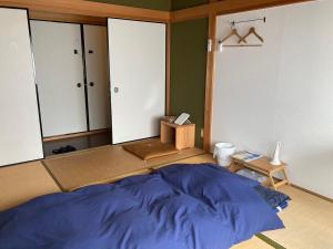 Ένα ή περισσότερα κρεβάτια σε δωμάτιο στο Lacomaゲストハウスー海と星空にとけこむ癒しの宿 +28 φωτογραφίες