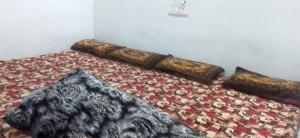 Ένα ή περισσότερα κρεβάτια σε δωμάτιο στο Murli Manohar homestay