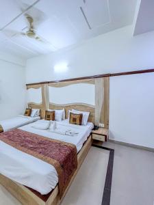 Ένα ή περισσότερα κρεβάτια σε δωμάτιο στο Hotel The Golden View +10 φωτογραφίες