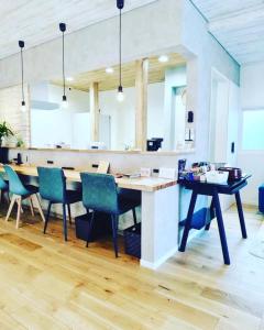 a dining room with a large table and chairs at TC1 Nagano - Vacation STAY 10022v in Okaya