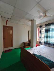 Postel nebo postele na pokoji v ubytování Hotel Priyashi International