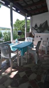 a patio with a table and chairs on a porch at Holiday Home Bah in Kruševo