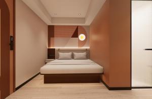 a small bedroom with a bed in a room at A Hotel Farrer Park - Newly Renovated in Singapore