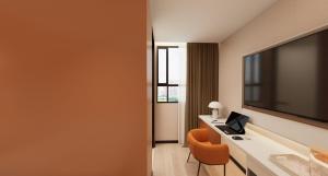 a hotel room with a desk with a computer on it at A Hotel Farrer Park - Newly Renovated in Singapore