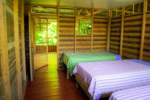 Uma cama ou camas num quarto em Isuyama Hostel