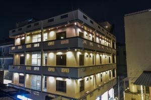 a building with lights on top of it at night at Hotel Good Luck Palace in Jaipur