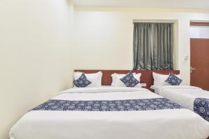 Ένα ή περισσότερα κρεβάτια σε δωμάτιο στο Hotel Good Luck Palace