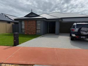 a car parked in front of a house at Milbridge Getaway with a bathroom in each room in Eaton