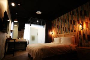 Postel nebo postele na pokoji v ubytování NYS Loft Hotel