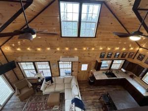 an overhead view of a living room in a log cabin at WiFi & Hot Tub Large Family - Climb On in RRG in Rogers +24 photos