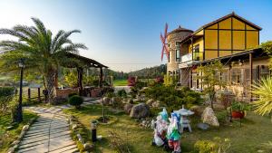 a house with a garden in front of it at 王老爺花園民宿Le Jardin de Monsieur Wang in Jinhu