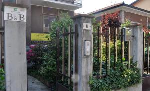 a metal fence with the numbers b and b on it at B&B Santa Monica in Pero