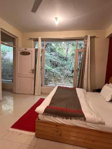 Postel nebo postele na pokoji v ubytování Junglaat Stays & Experiences