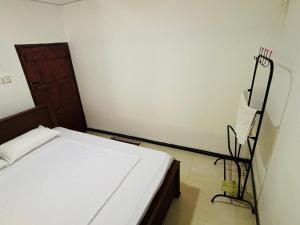 Ένα ή περισσότερα κρεβάτια σε δωμάτιο στο Hideout Deniyaya