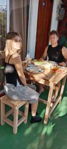 a man and a woman sitting at a table at Talblick Valley in Ella +13 photos