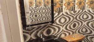 a mirror on a wall next to a toilet at Talblick Valley in Ella