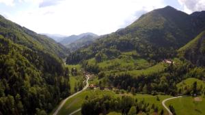 an aerial view of a valley in the mountains at Guest House Gostišče Gačnk V Logu in Cerkno