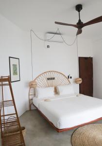 Ένα ή περισσότερα κρεβάτια σε δωμάτιο στο The Banyan Ahangama