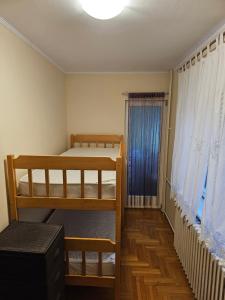 Ένα ή περισσότερα κρεβάτια σε δωμάτιο στο Milana centar