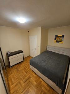 Ένα ή περισσότερα κρεβάτια σε δωμάτιο στο Milana centar