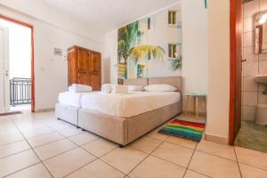 A bed or beds in a room at Antisamos Studios